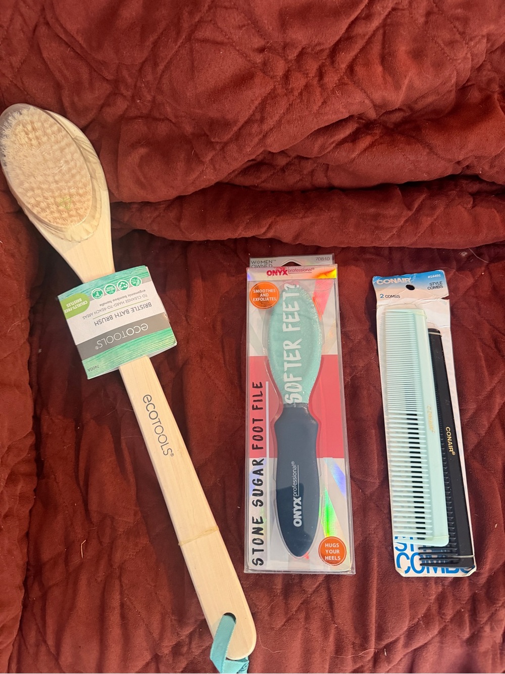 ecotools Bamboo Long Handle Body Brush with Teal Loop on Rust Background